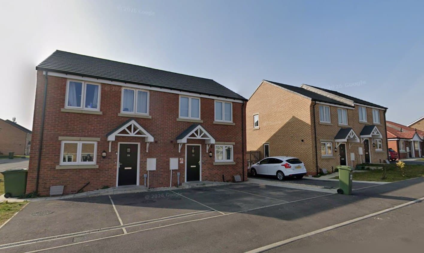 Coates Avenue, Winterton: pair of buff-brick semi-detached homes with red-brick detailing and canopy porches beside a parking court, Ongo Homes affordable scheme