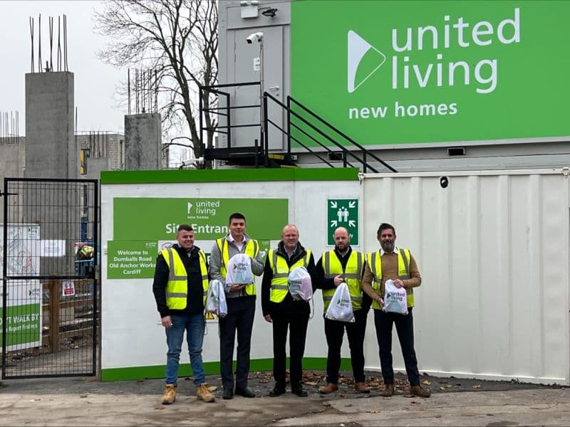 Project team at the Anchor Works site entrance, Cardiff