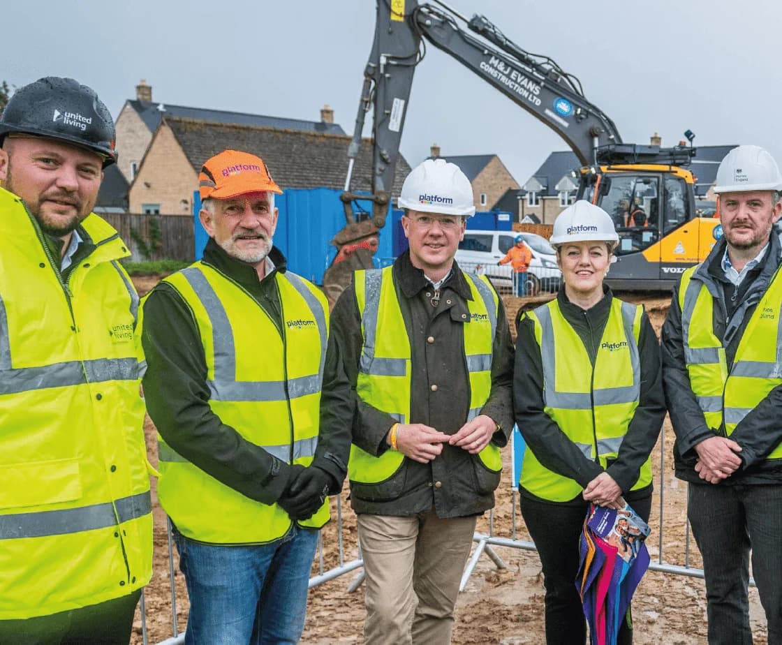 Project team at Milestone Road (The Falcons), Carterton, with the Platform Housing client team and tracked excavator on site
