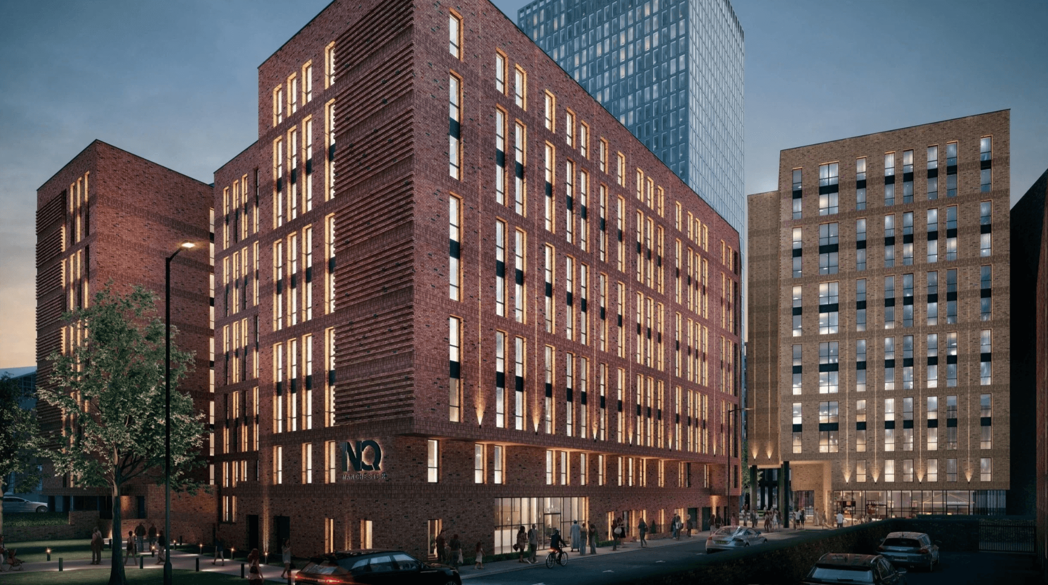 1NQ, Tariff Street, Manchester Northern Quarter: render of the completed 9-storey red-brick mid-rise BTR block at dusk with windows lit up, neighbouring towers behind, Marco Living / Axis RE / CDL scheme