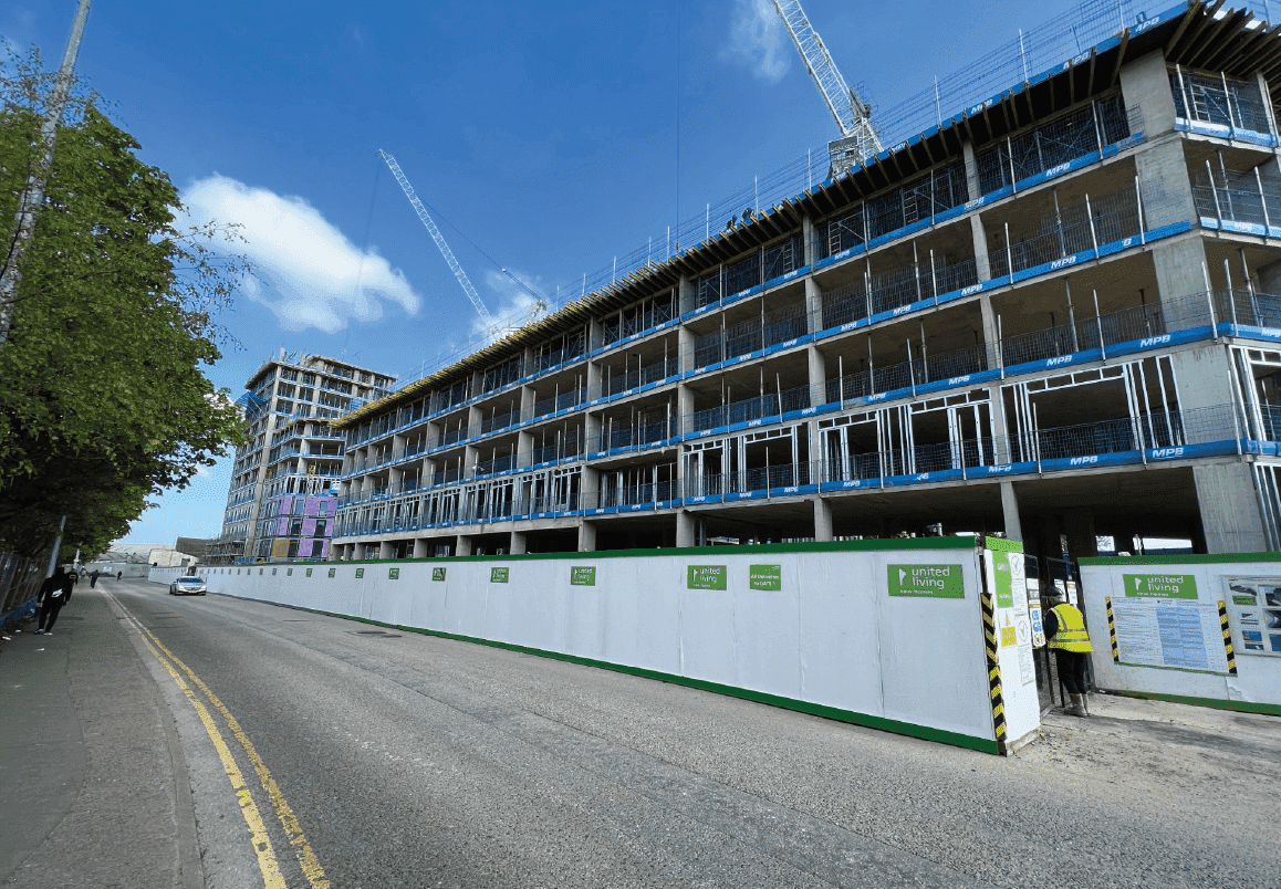 Anchor Works, Dumballs Road, Cardiff: 432-home BTR tower wrapped in scaffolding mid-construction, site hoarding and tower crane in view