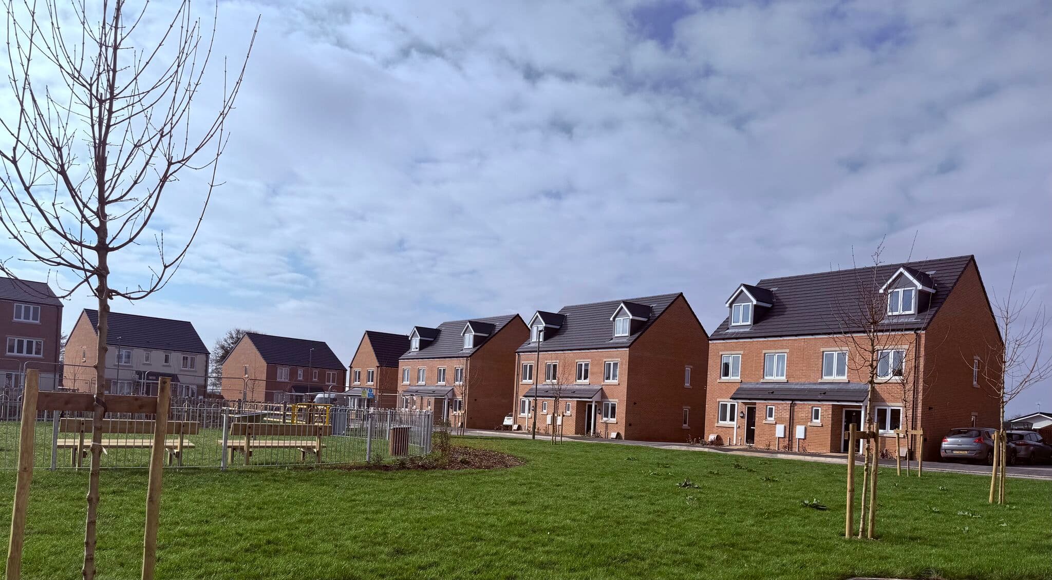 Milestone Road, Carterton: external view of completed BREE-built affordable homes for Platform Housing, brick + render facade with private gardens