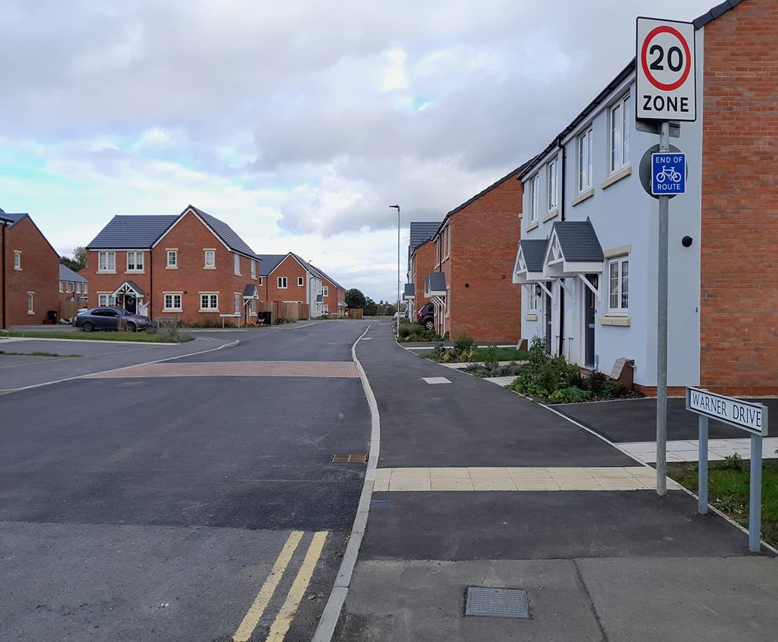 Wheater's Meadow: Warner Drive street entrance with 20mph zone signage and the completed estate beyond