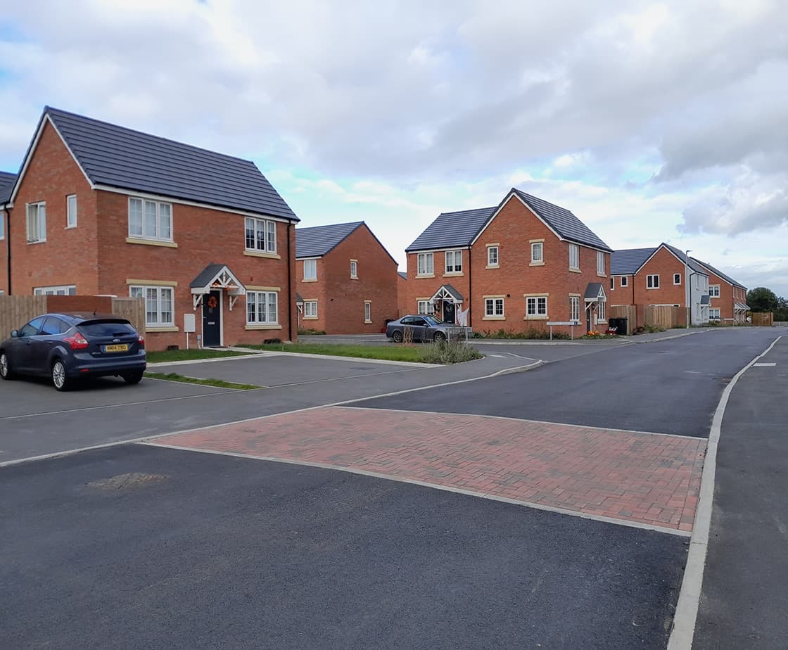 Wheater's Meadow: red-brick detached homes with shared driveways and block-paved tributary